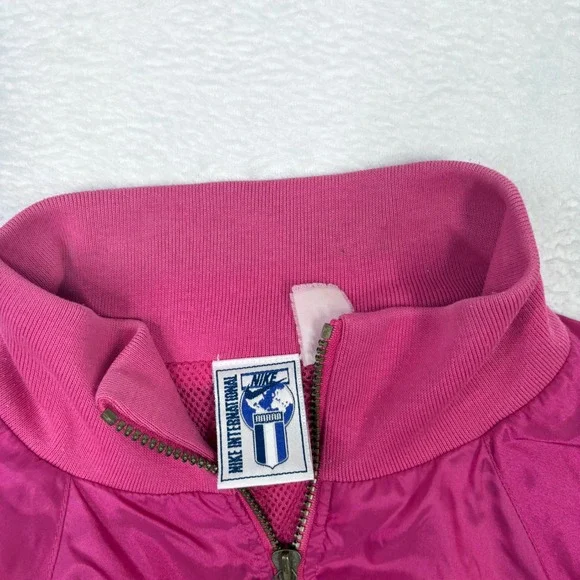 Vintage Nike International Windbreaker Jacket Pink Gold Embroidered Logo Track